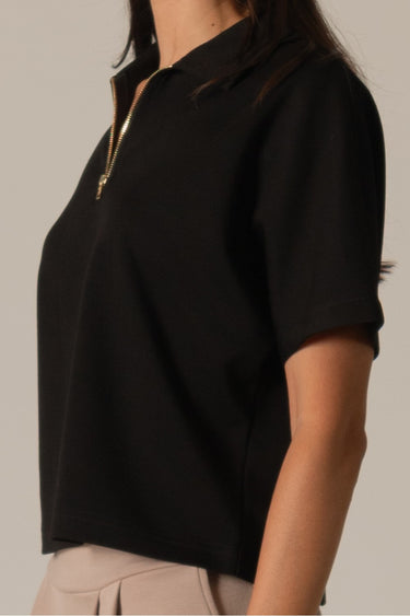 Black Half Zip Top by Pcil at 6Whiskey, six whisky, short sleeve, quarter zip neckline, gold zipper detail, soft, comfortable, cropped, relaxed, loungewear, errands, at home, matching set. Side view.