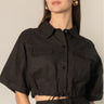 Black Linen Cropped Top by Pcill at 6Whiskey, six whisky, button down, collar, draw string detail, lightweight, breathable, western, country, casual, everyday, pockets, short sleeve, cool girl, sleek. Front view.