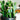 Cactus Drop Earrings at 6Whiskey. Pair of cactus-shaped drop earrings with green enamel, pink accents, and black pots, topped with faux pearl cluster studs, displayed on a vibrant potted cactus