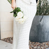 The Love Note Dot Skirt, midi length, long, maxi, elastic waistband, flowy, slimming, flattering, feminine, classy, elegant, chic, it girl, trendy, office skirt, lunch date, casual elevated, it girl, cool girl, lightweight, comfortable, stretchable, must-have basic, year-round skirt, front view