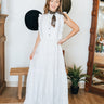The Prairie Lace Dress by Tasha Polizzi at 6Whiskey, six whisky, Paris dress, white maxi dress, tiered, embroidery, delicate, elegant, feminine, western, chic, stylish, it girl, country concert, rodeo, church, lunch, two stepping, concho button, ruffle hemline, ruffle neckline, flowy, flattering. Front view.