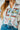 Old Town Graphic Button Down by Tasha Polizzi at 6Whiskey six whisky, featuring colorful western illustrations like cowboy boots, “Howdy” text, and cacti, styled with high-rise distressed denim shorts 