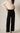 Black Side Stripe Wide Pant Leg by Pcill, 6whiskey, six whisky, soft, comfy, cozy, elevated basic, neutral, sleek, sporty, loungewear, casual, black, white side stripe. high waisted, elastic waistband, front view.
