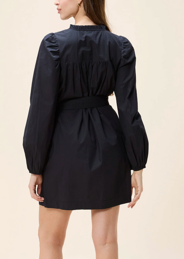 Ivana Mini Dress by Cleobella at 6Whiskey, six whisky, puff sleeves, pockets, lightweight, breezy, elevated, timeless, classy, southern, work wear, lunch date, day to night, date night, western, tie front, split neck, ruffled detailing, puff sleeve, mini dress, short dress, black dress, back view.