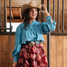 Heritage Smocked Denim Blouse at 6Whiskey, six whisky, long sleeve, balloon sleeve, cuff, placket, western yolk detail, breathable, lightweight, warm weather, frill detail, southern charm, SEC, church blouse, rodeo, brunch date, weekend outfit, modern western, casual, casual western, women's fashion, women's clothing, front view.