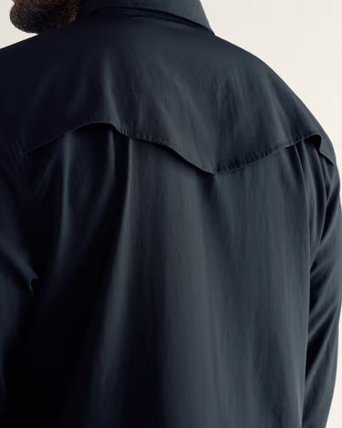 Long Sleeve Performance Pearl Snap by Tecovas at 6Whiskey, six whisky, front pockets, black on black, collared, breathable, elevated western, refined, elegant, men's western, work to weekend, sleek, western yolk stitching, ventilation, UV protection, sweat proof, moves with you, all year round staple, mens gift, rodeo, date night, versatile button down, back view.