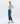 6Whiskey womens pants Audrey High-Rise Cuffed Straight Jeans in medium blue wash with raw-edge wide cuffs, straight-leg fit, and flattering high waist, styled with sandals