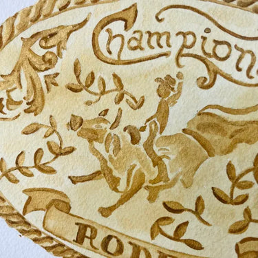 Trophy Buckle Art Print by Catherine Cartie at 6Whiskey, six whisky, rodeo, champion, bucking bronco, rope, braided detailing, gold, yellow, white, watercolor, home decor, art, western, texas, vintage, classic, rugged, detail view.