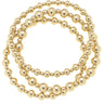 Gold Stretch Bracelets at 6Whiskey six whisky. Set of three gold-tone beaded stretch bracelets in varying bead sizes, coiled together on a white background.
