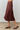Chocolate Suede Midi Skirt at 6Whiskey, six whisky, side pockets, high waisted, paneling, lines, a-line, flattering, casual western, work wear, office outfit, womens fashion, flowy, fall, winter, transition piece, brown, dark brown, side view.