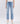 6Whiskey women's pants Hailey High-Rise Distressed Straight Jeans in light blue wash with ripped knee details and raw hem, paired with white sneakers