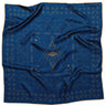 Hell Yeah Scarf by Jenni Earle at 6Whiskey, six whisky, square scarf, artful, eclectic, edgy, cool girl, it girl, warm weather nights, elevated western, bag accessory, hat accessory, twilly, bandana, deep blue, gold accent, contrast boarder, celestial, evil eye, stars, geometric pattern, eye-catching, unique, front view