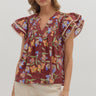 Maroon Meadow Top at 6Whiskey, six whisky, short sleeves, ruffle sleeves, beige contrast piping, button closure, pleated, split neck, feminine, botanical design, floral, flowers, greenery, orange, green, purple, flattering, casual, everyday, tamu, texas a&m, gameday, tailgate, lunch date, front view