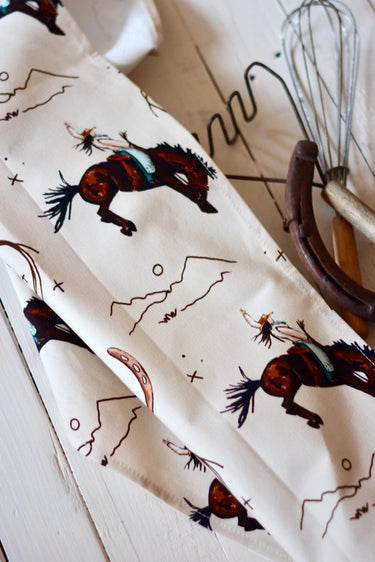 Yeehaw Cowgirl Tea Towel at 6Whiskey six whisky tirzah lane art hand drawn hande made stars roping cowgirl bucking horse horseshoe mountain pattern printed white home goods home decor kitchen towel