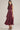 Aggie darling dress at 6Whiskey, six whisky, midi dress, adjustable belt, v-neck, sleeveless dress, casual dress, western, contrast piping detail, collar, game day, tailgating, texas a&m, SEC, front view, Full view, side view, full length, maroon dress, burgundy dress, gameday outfit, button up front dress, casual chic aggie dress, aggies, a&m outfit, belted waist dress.
