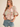 Maribel Mosaic Blouse at 6Whiskey, six whisky, split neckline, v-neckline, tie tassel front, 1/2 sleeve, flutter sleeve, puff sleeve, short sleeve, floral patterned, panel, geometric, multicolor, green, pink, orange, cream, lightweight, flowy, relaxed, spring and summer, lunch, brunch, church, work to weekend, feminine, front view