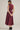 Aggie darling dress at 6Whiskey, six whisky, midi dress, adjustable belt, sleeveless dress, casual dress, western, contrast piping detail, collar, game day, tailgating, texas a&m, SEC, back view, full view, full length, maroon dress, burgundy dress, gameday outfit, casual chic aggie dress, aggies, a&m outfit, belted waist dress. 