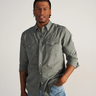Long Sleeve Performance Pearl Snap in cactus green by Tecovas at 6Whiskey, six whisky, green pearl snaps, brass rings, stretch, comfortable, breathable, texas weather, SEC, southern charm, western stitching, front pockets, lightweight, men's must have, men's gift idea, rodeo, country concert, date night, work, elevated western, sweat proof, ventilated, collared, front view. hidden sunglass wipe, hidden sunglass pocket. sleeve rolled up or down