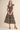 Midnight Garden Dress at 6Whiskey six whisky, panel, geometric, floral, patterned, purple, navy, yellow, orange, green, split neckline, v-neck, sleeveless, ruffle sleeve, ruffle hem, smocked back, feminine fit, flattering, romantic, dramatic, bold, eye-catching, edgy western, cool girl, eclectic, elevated, women's dress, midi dress, women's clothing, fashion, front view