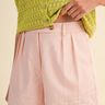 Rosebud Stitched Shorts at 6Whiskey, six whisky, baby pink, light pink, dusty pink, tailored look, pleated, tortoise shell buttons, belt loops, side pockets, faux back pockets, diamond embroidery white hem stitching, high waisted, flattering, feminine, southern charm, southern belle, girly, lined, modest length, summer and spring style, lunch, church, errands, market, casual chic, effortless cool, it girl, polished, put together, refined, front view