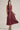 Aggie darling dress at 6Whiskey, six whisky, midi dress, adjustable belt, v-neck, sleeveless dress, casual dress, western, contrast piping detail, collar, game day, tailgating, texas a&m, SEC, front view, full view, full length, maroon dress, burgundy dress, gameday outfit, button up front dress, casual chic aggie dress, aggies, a&m outfit, belted waist dress.