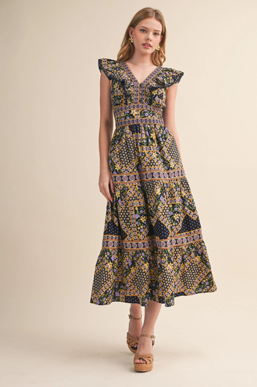 Midnight Garden Dress at 6Whiskey six whisky, panel, geometric, floral, patterned, purple, navy, yellow, orange, green, split neckline, v-neck, sleeveless, ruffle sleeve, ruffle hem, smocked back, feminine fit, flattering, romantic, dramatic, bold, eye-catching, edgy western, cool girl, eclectic, elevated, women's dress, midi dress, women's clothing, fashion, front view