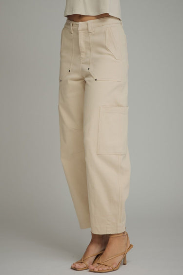 Kickoff cargo pants at 6whiskey, six whisky, woman wearing cream cargo barrel pants, ideal for fall game day or tailgate looks at texas a&m, aggies, SEC, gameday outift inspo, cargo barrel jeans, button details, front & side view, football game outfit, watch party look, game day to everyday look. Pair with maroon or burgundy aggie accessories and sneakers, sandals, or booties. Texas A&M aggie style. Everyday casual chic aggie style. Barrel pants for fall fashion. Pockets, belt loops, zip fly closure.