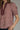 Gridiron gingham blouse at 6whiskey, six whisky, woman wearing a burgundy maroon gingham print blouse with jeans, ideal for fall game day or tailgate looks at texas a&m, aggies, SEC, gameday outift inspo, elasticated gathered mid length sleeve blouse, ruffle detail neck, up close front detail view, football game outfit, watch party look, game day to everyday look. Pair with black, white, or blue jean denim or aggie accessories and sneakers, sandals, or boots. Texas A&M aggie style. Casual chic aggie style.