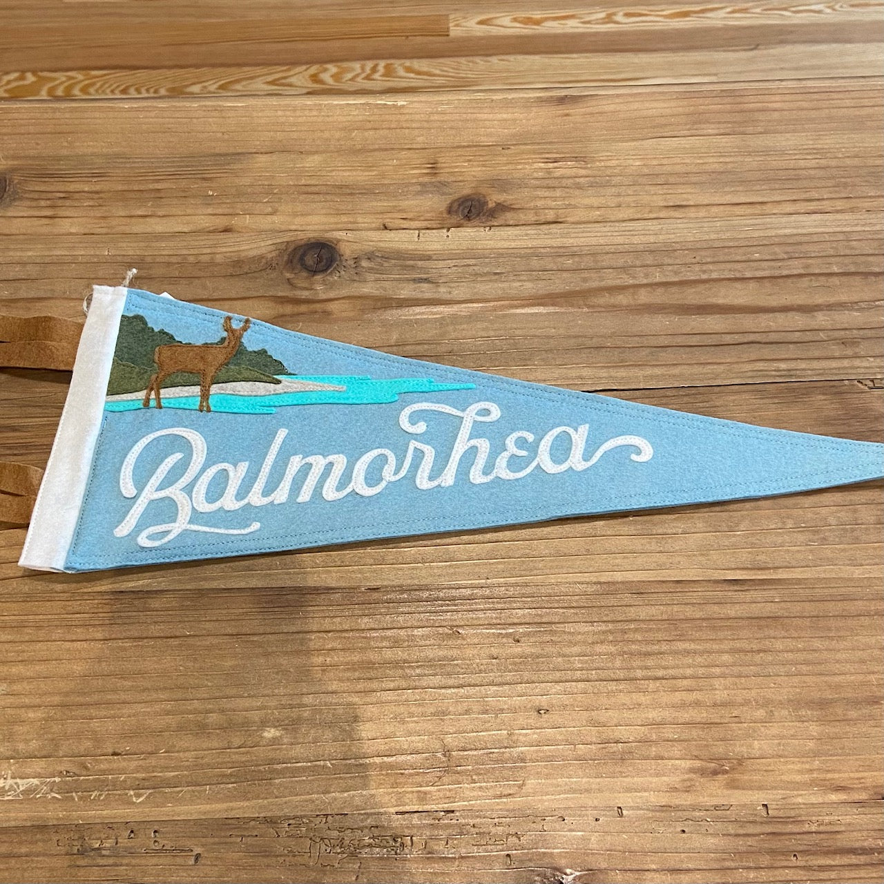 Load image into Gallery viewer, Balmorhea Texas State Park Handmade Felt Pennant at 6Whiskey six whisky  in color light blue featuring deer and water
