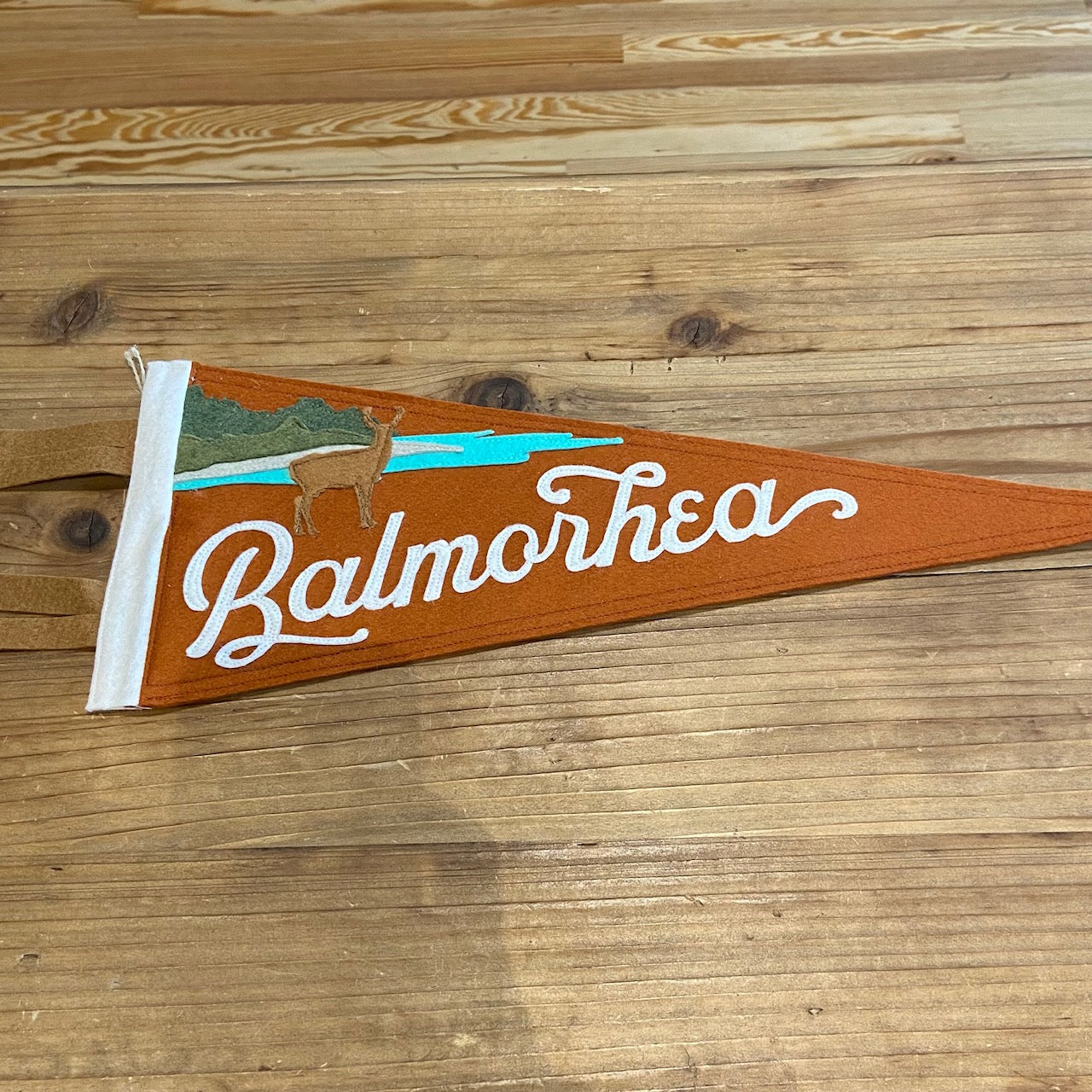 Load image into Gallery viewer, Balmorhea Texas State Park Handmade Felt Pennant at 6Whiskey six whisky in color burnt orange featuring deer and water
